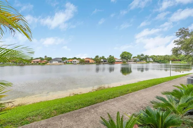 a view of a lake with a big yard