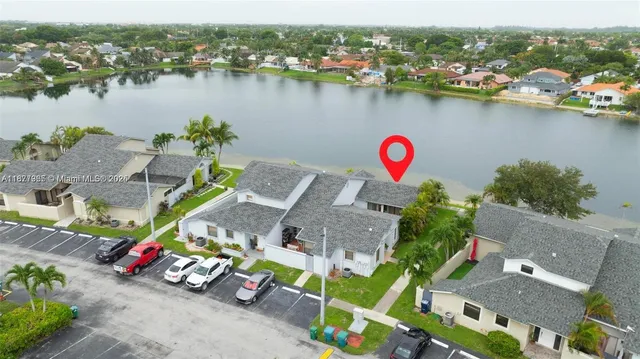 an aerial view of a house with a ocean view