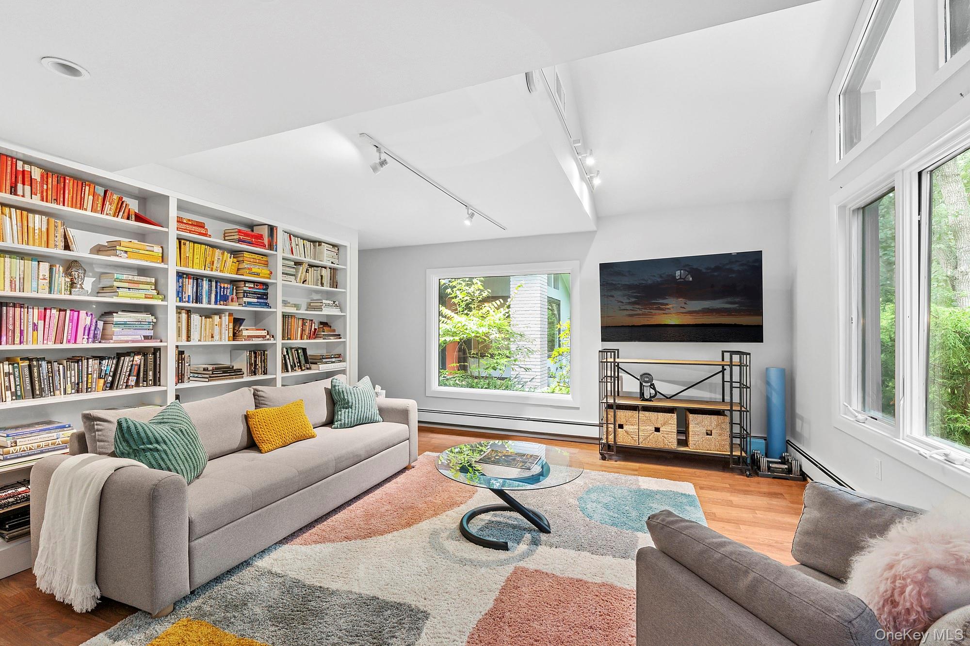 2723 Deerfield Road Sag Harbor, NY 11963 - Photo 16 of 22 a living room with furniture workspace and a flat screen tv
