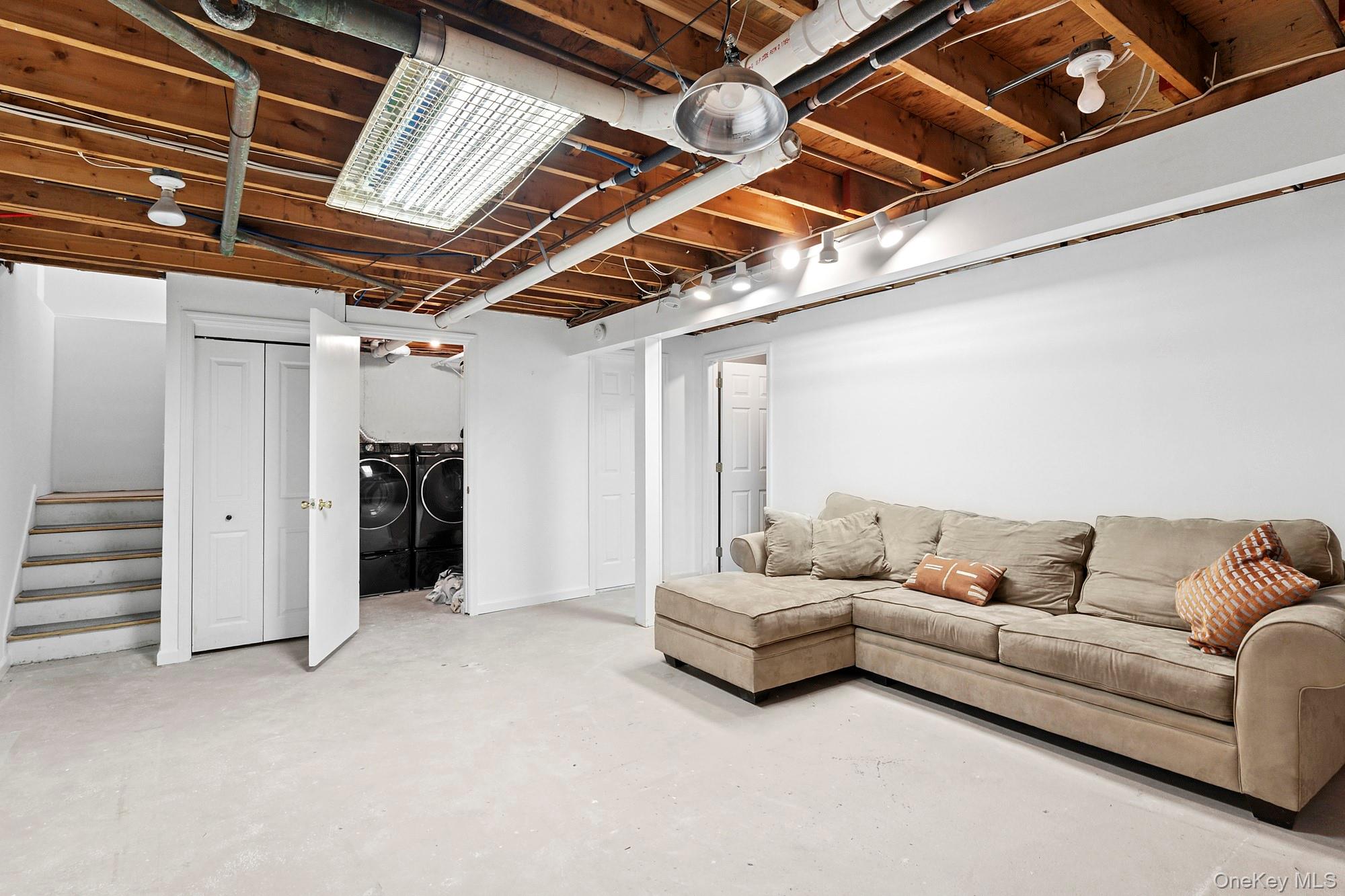 2723 Deerfield Road Sag Harbor, NY 11963 - Photo 18 of 22 a living room with furniture and white walls