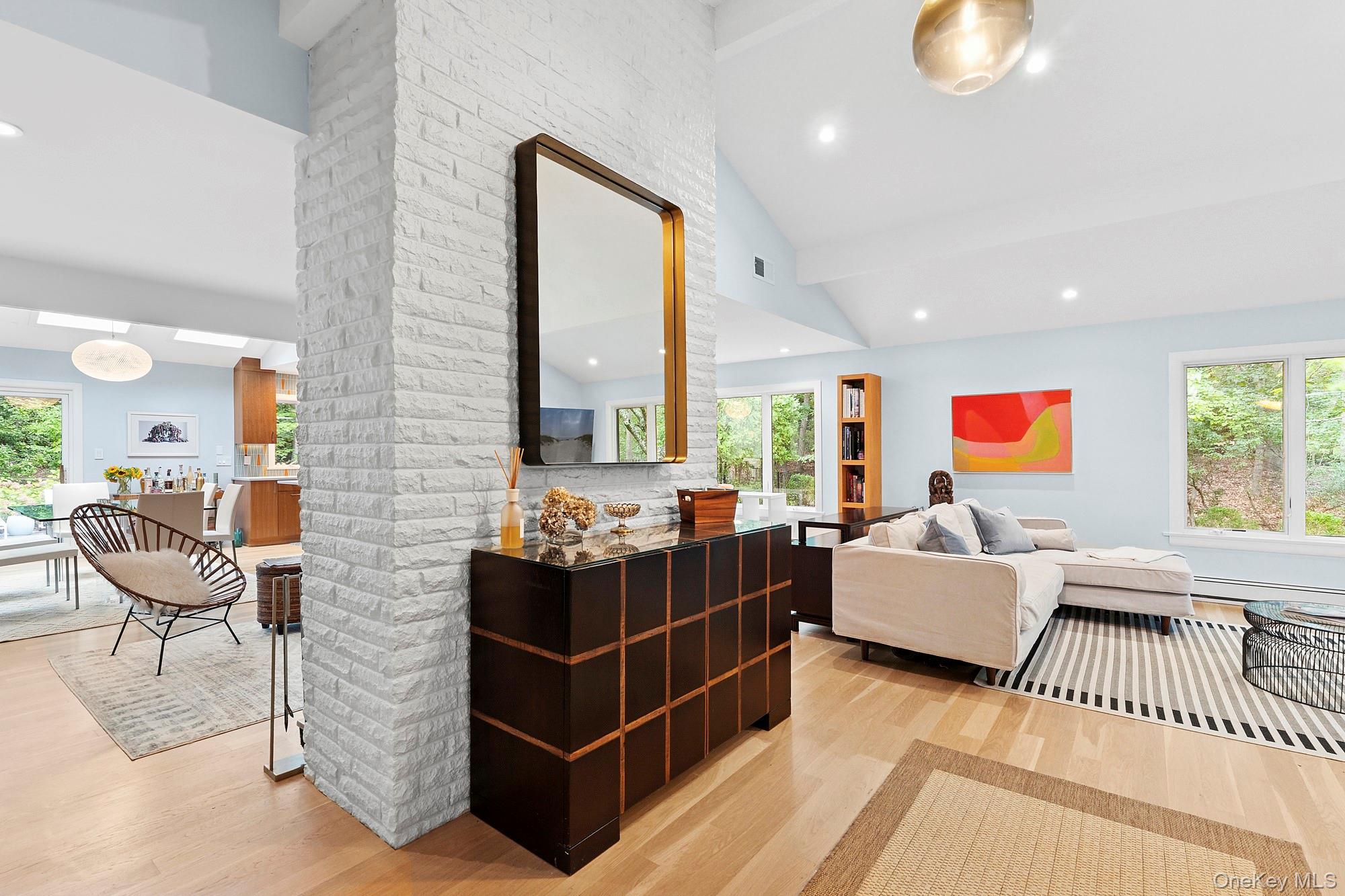 2723 Deerfield Road Sag Harbor, NY 11963 - Photo 20 of 22 a living room with furniture and a flat screen tv