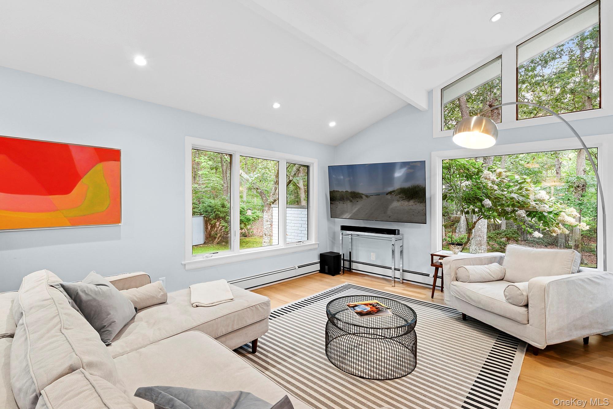2723 Deerfield Road Sag Harbor, NY 11963 - Photo 4 of 22 a living room with furniture and a flat screen tv