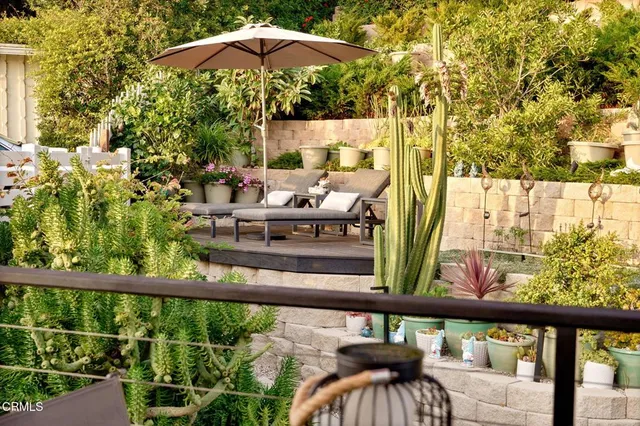 a view of a balcony with chairs