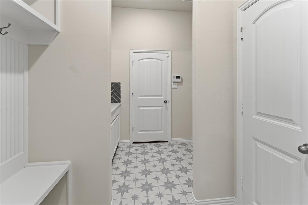 104 Snowy Owl Trail Rhome, TX 76078 - Photo 9 of 27 Entryway with star-patterned tile flooring