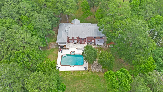 an aerial view of a house with a garden