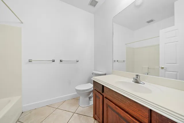 a bathroom with a sink toilet and vanity