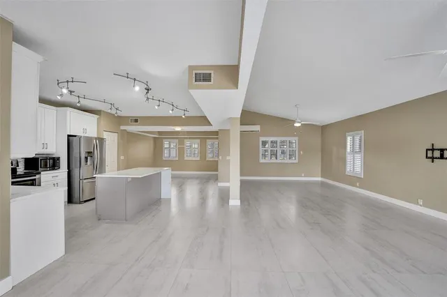 a view of an entryway with wooden floors