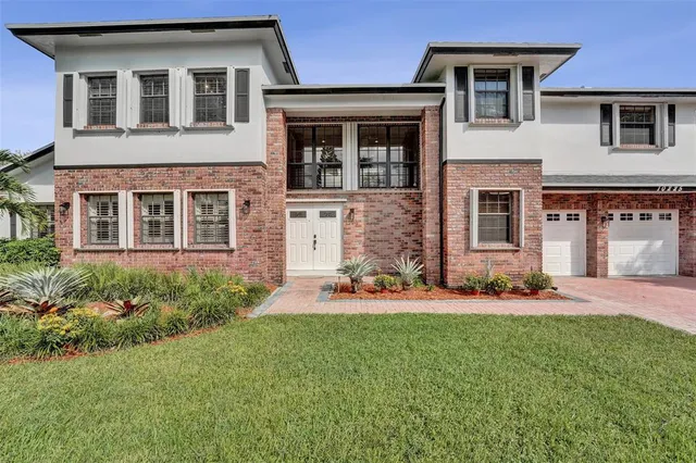 front view of a house with a yard