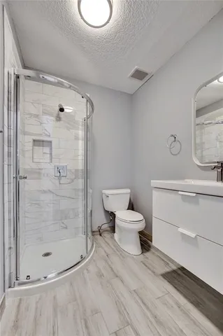 an empty room with windows and closet