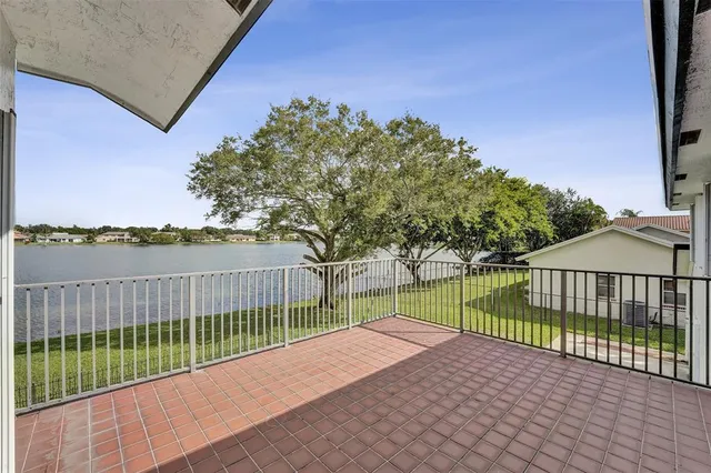 an empty room with entrance and windows