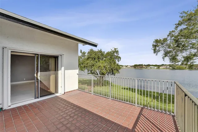 a view of a lake with houses in the back