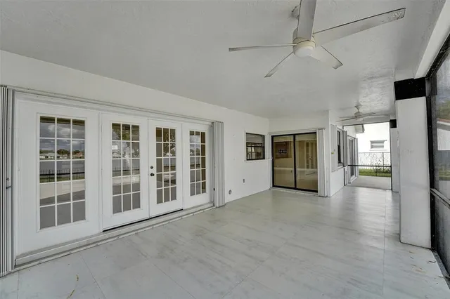 a view of a lake with houses in the back