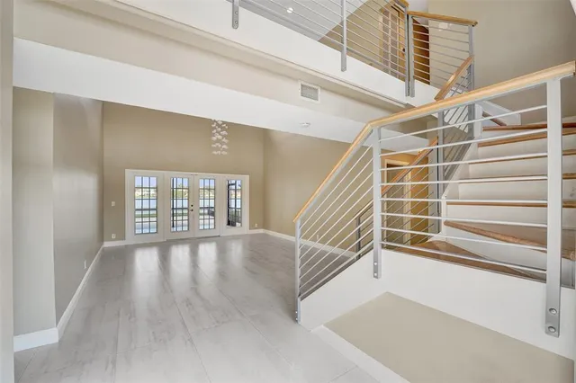 a view of an entryway with wooden floor and windows