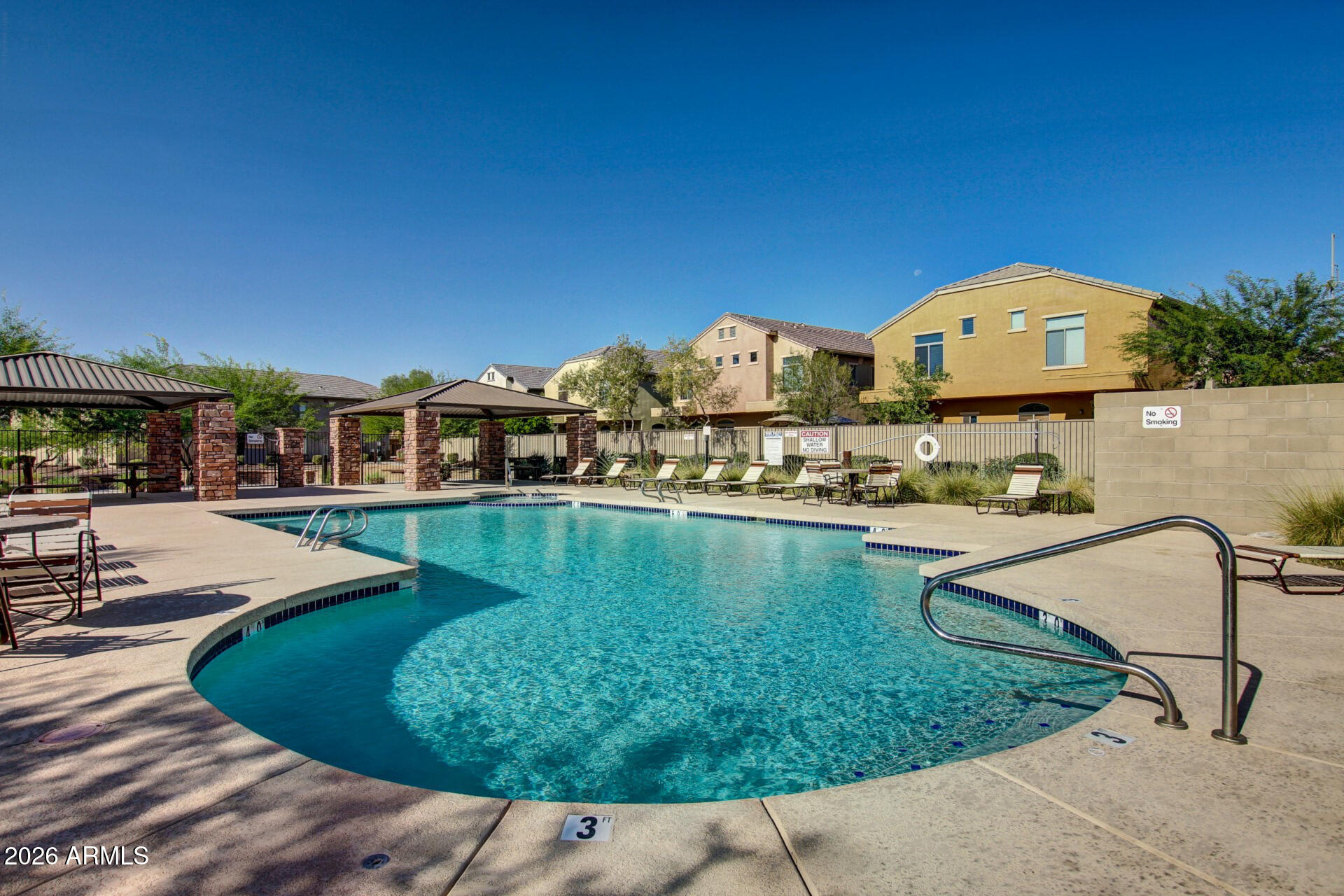2725 East Mine Creek Road, Unit 1101 Phoenix, AZ 85024 - Photo 34 of 43 a view of a swimming pool with a lounge chairs