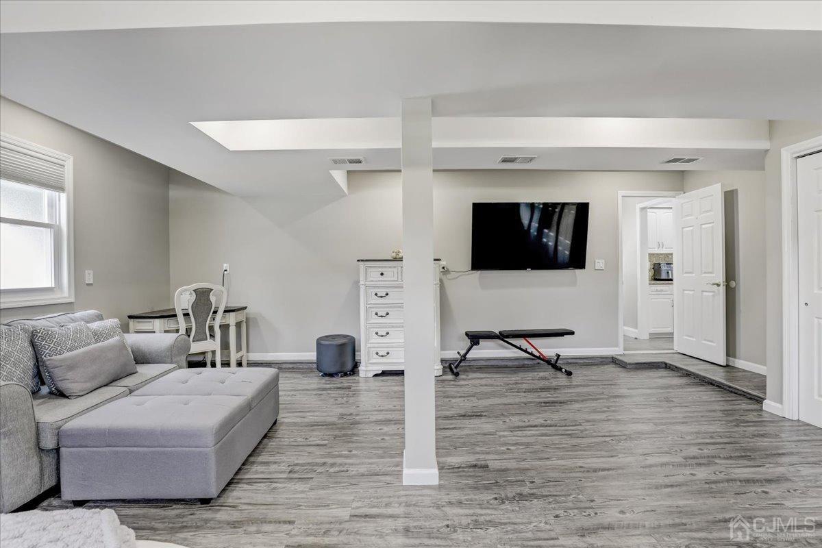 10 William Way Old Bridge, NJ 07747 - Photo 11 of 33 a living room with furniture and a flat screen tv