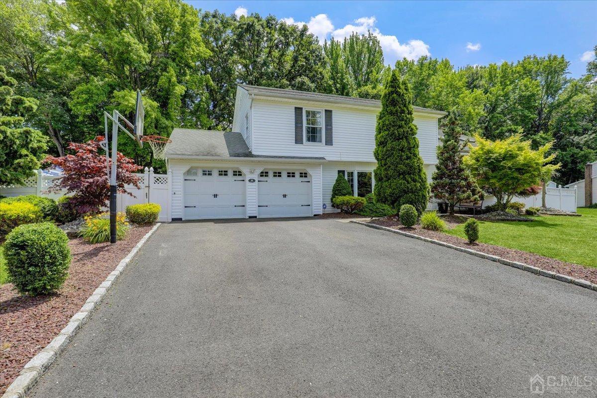 10 William Way Old Bridge, NJ 07747 - Photo 3 of 33 a view of a house with a yard and a garage