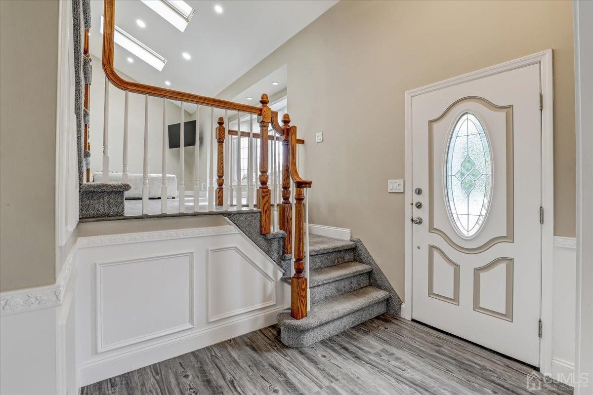 10 William Way Old Bridge, NJ 07747 - Photo 4 of 33 a view of a hallway with wooden floor and staircase