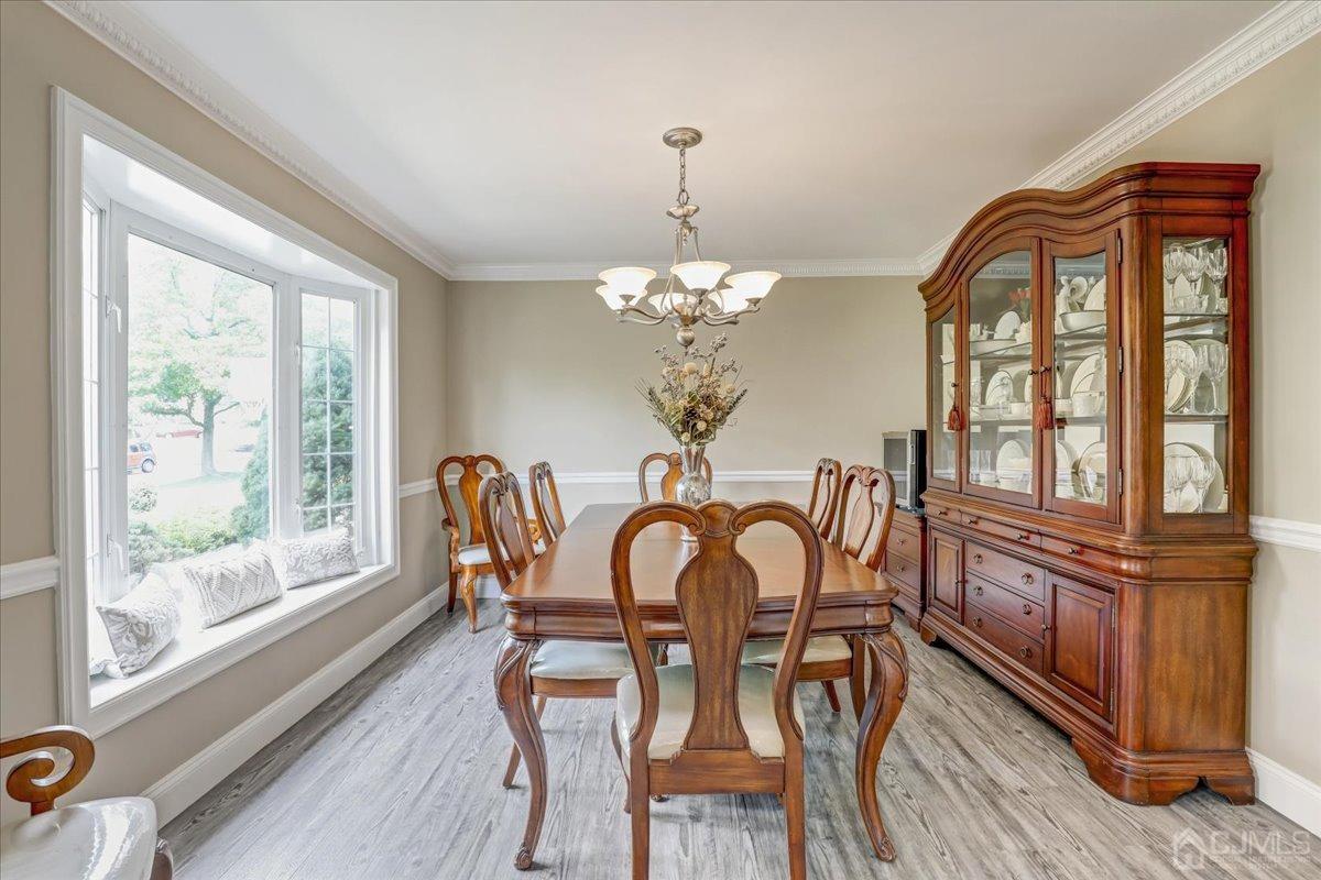 10 William Way Old Bridge, NJ 07747 - Photo 5 of 33 a view of a dining room with furniture a chandelier and wooden floor