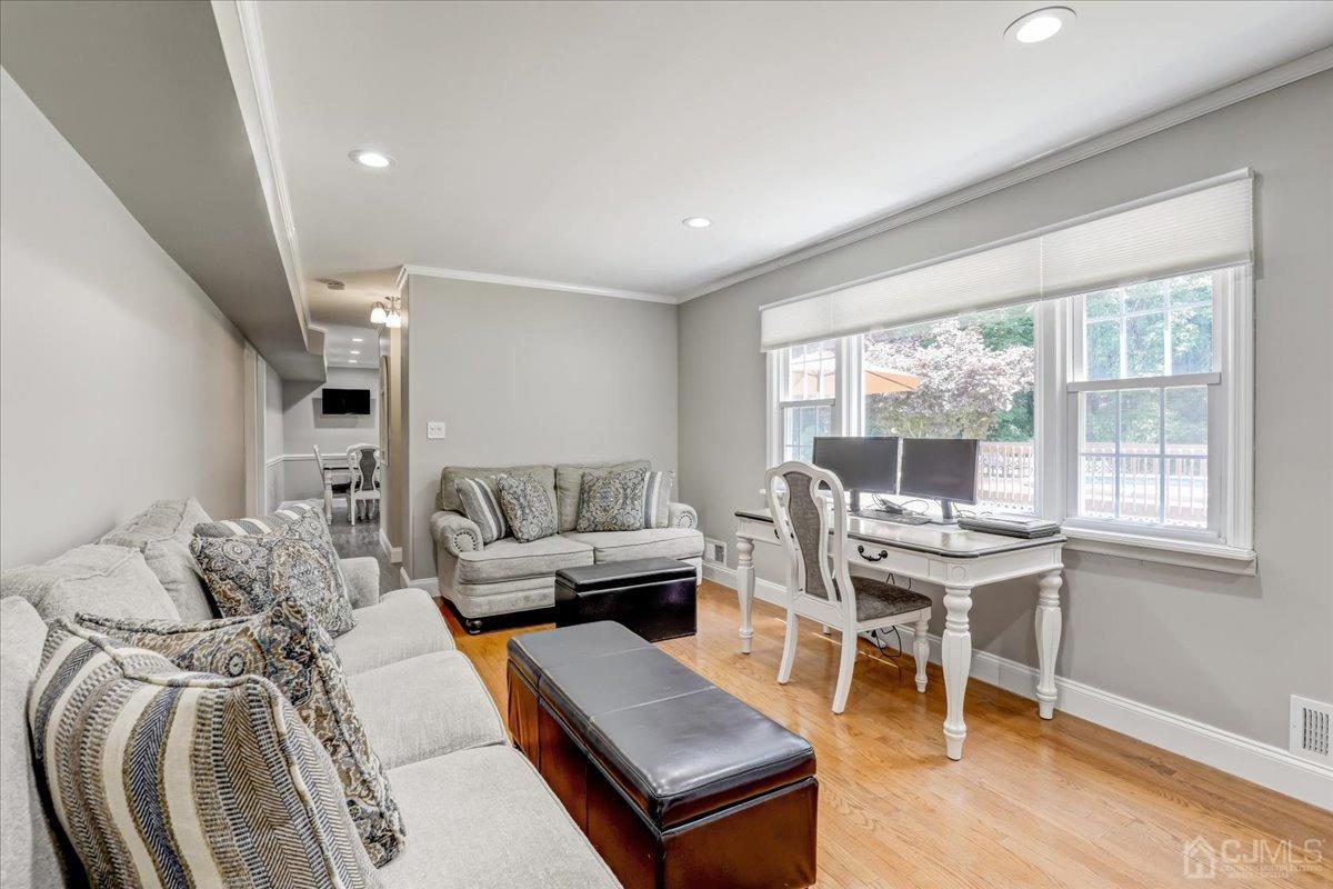 10 William Way Old Bridge, NJ 07747 - Photo 10 of 33 a living room with furniture a wooden floor and a large window