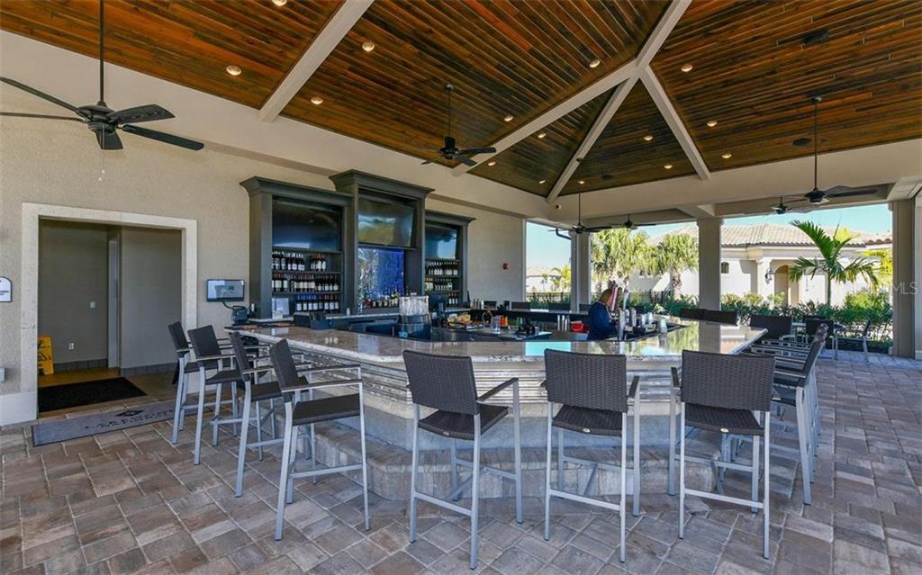 5528 Arnie Loop Lakewood Ranch, FL 34211 - Photo 43 of 59 a view of a dining room with furniture window and outside view