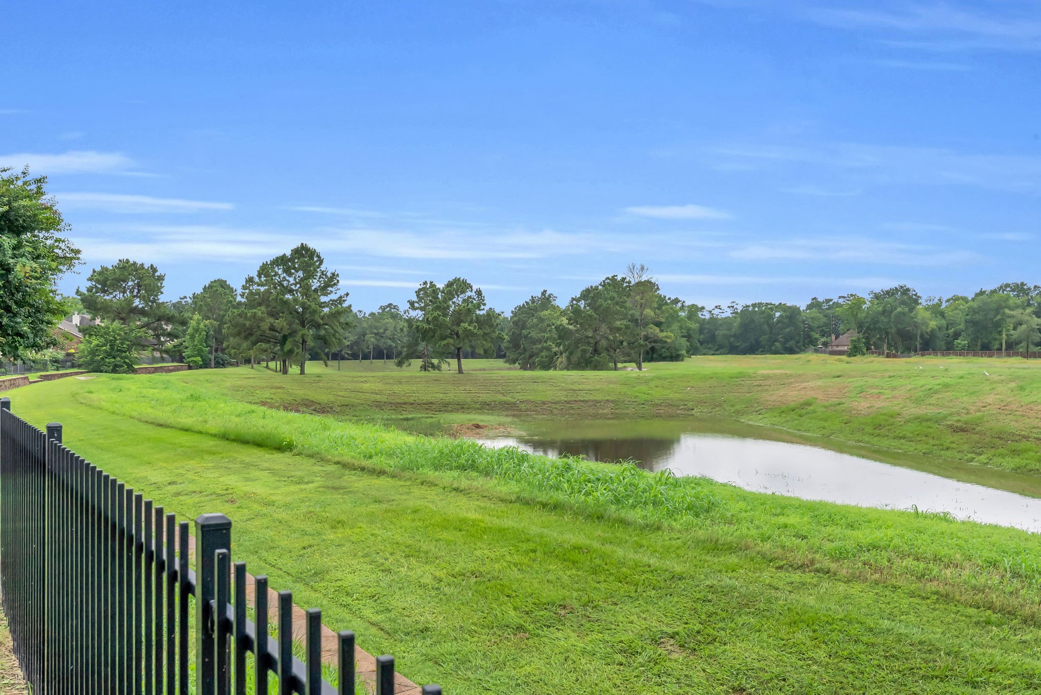 16619 Dover Mills Drive Spring, TX 77379 - Photo 41 of 49 a view of a golf course with a lake