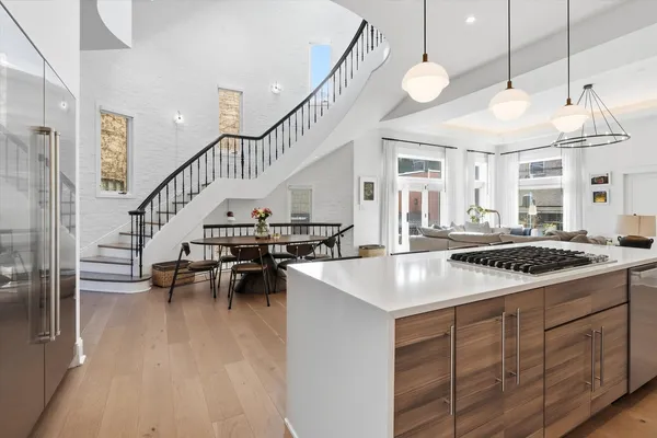 a view of staircase with railing and white walls