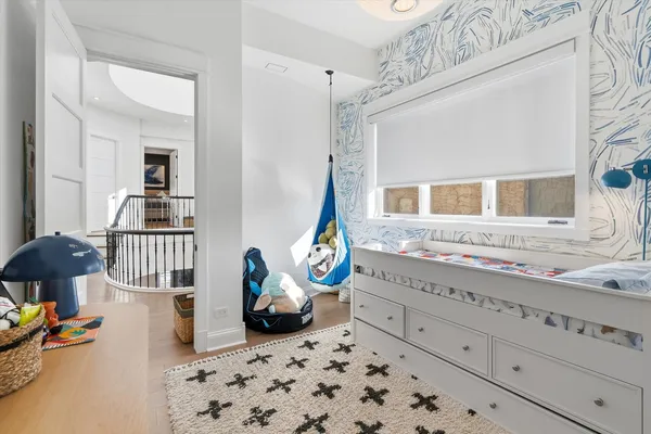 a room with a bed and a dresser