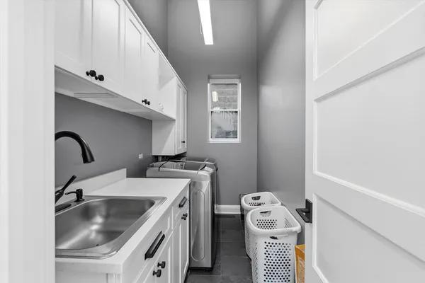 a bathroom with a glass shower door and a sink