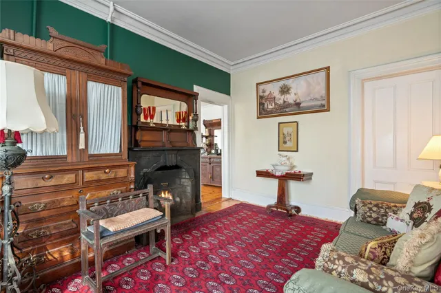 a bedroom with a bed and a fireplace