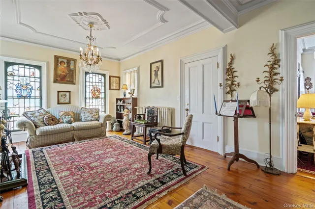 a living room with furniture rug and window
