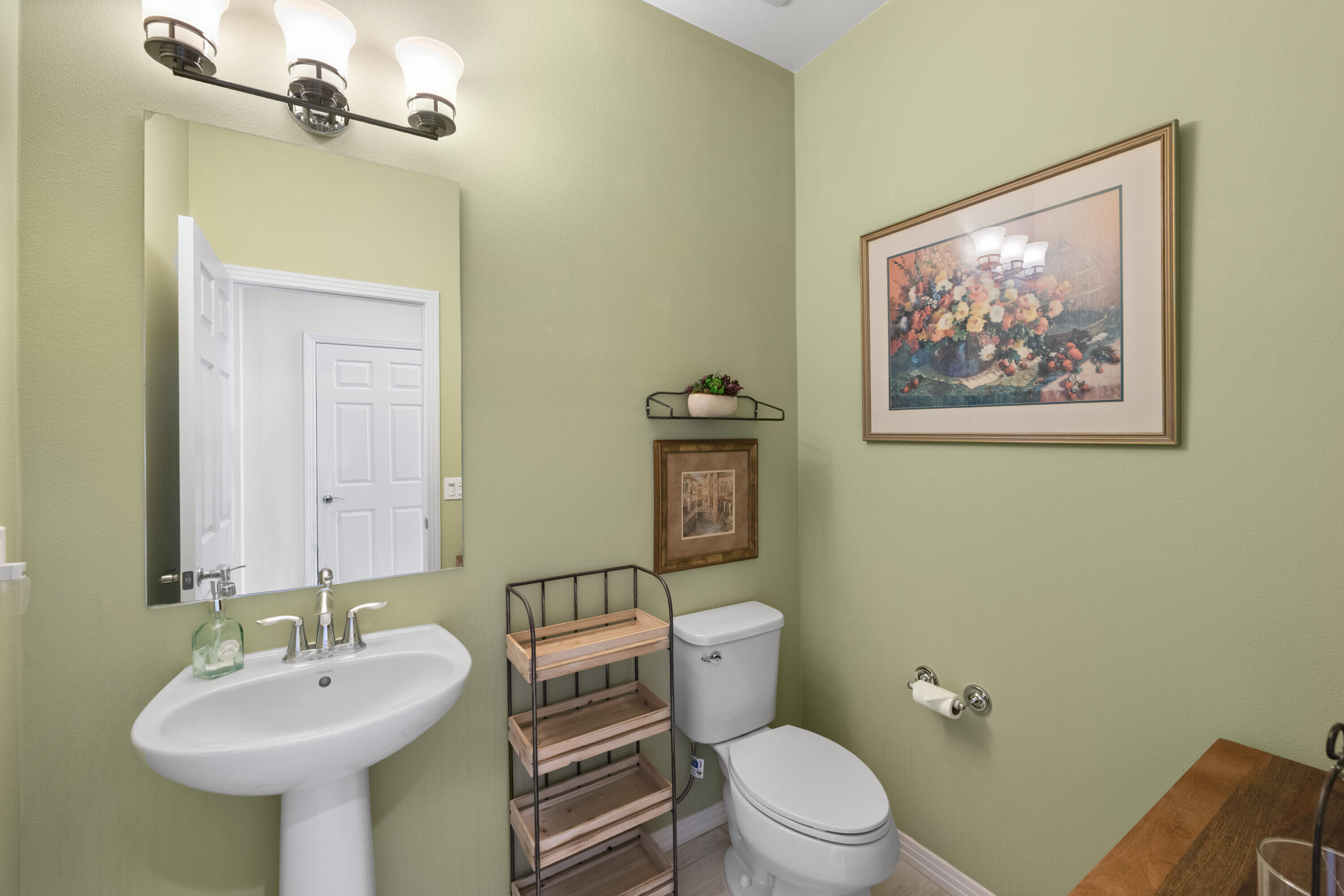 78863 Amare Way Palm Desert, CA 92211 - Photo 14 of 39 a bathroom with a toilet a sink and mirror