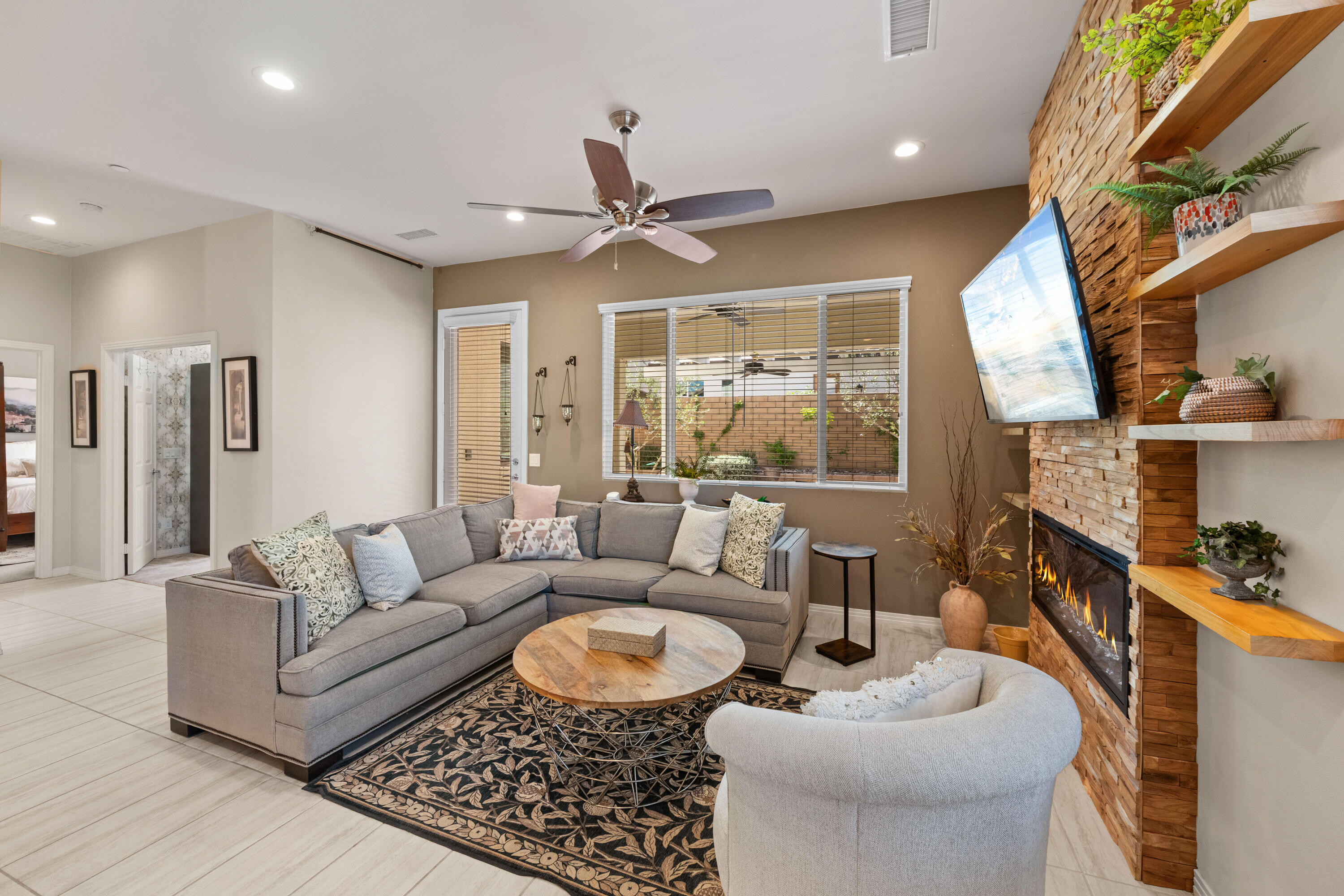 78863 Amare Way Palm Desert, CA 92211 - Photo 16 of 39 a living room with furniture and a large window