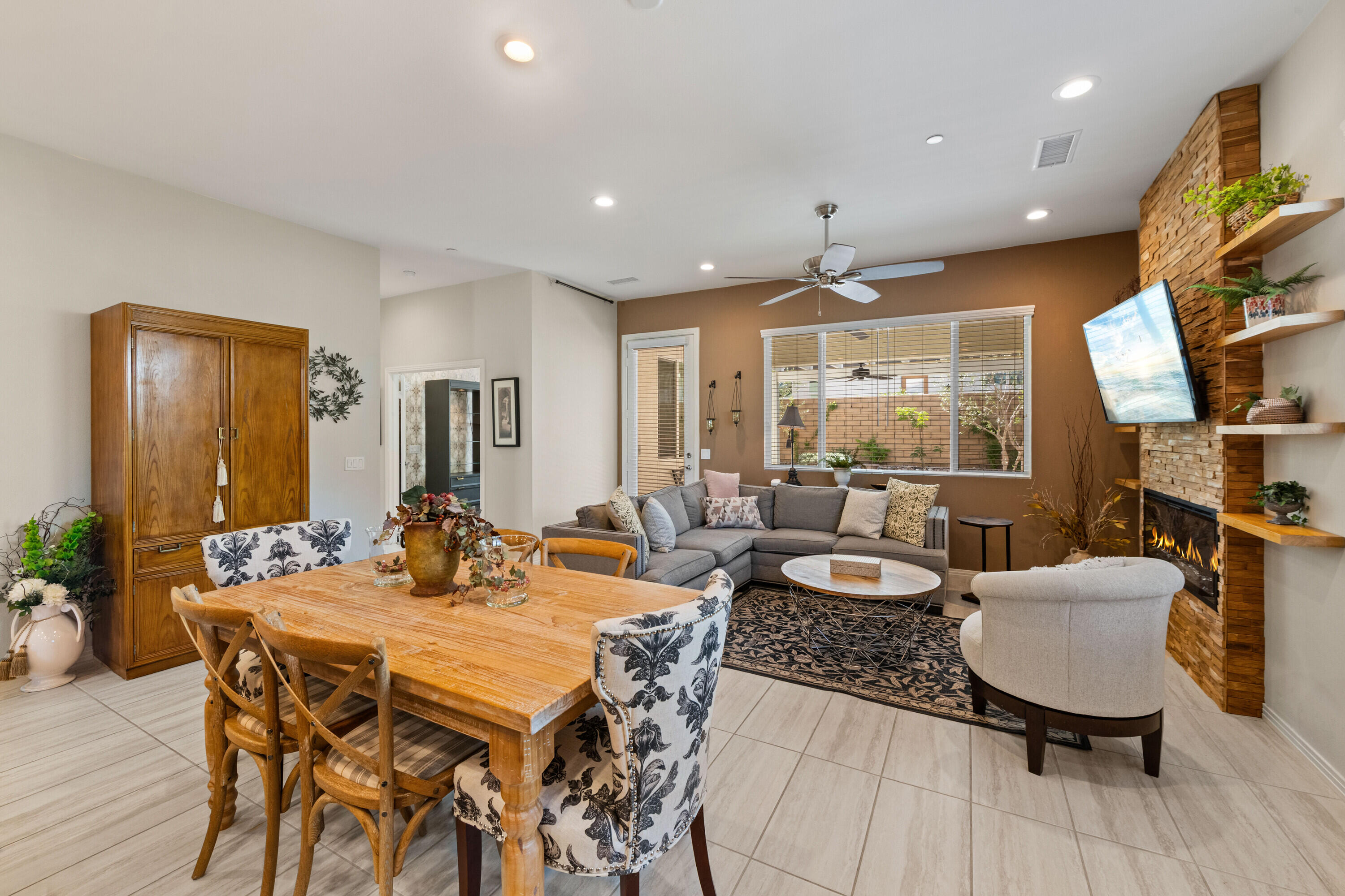 78863 Amare Way Palm Desert, CA 92211 - Photo 18 of 39 a dining room with furniture a rug and wooden floor