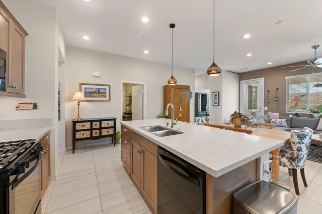 a kitchen with refrigerator cabinets and wooden floor