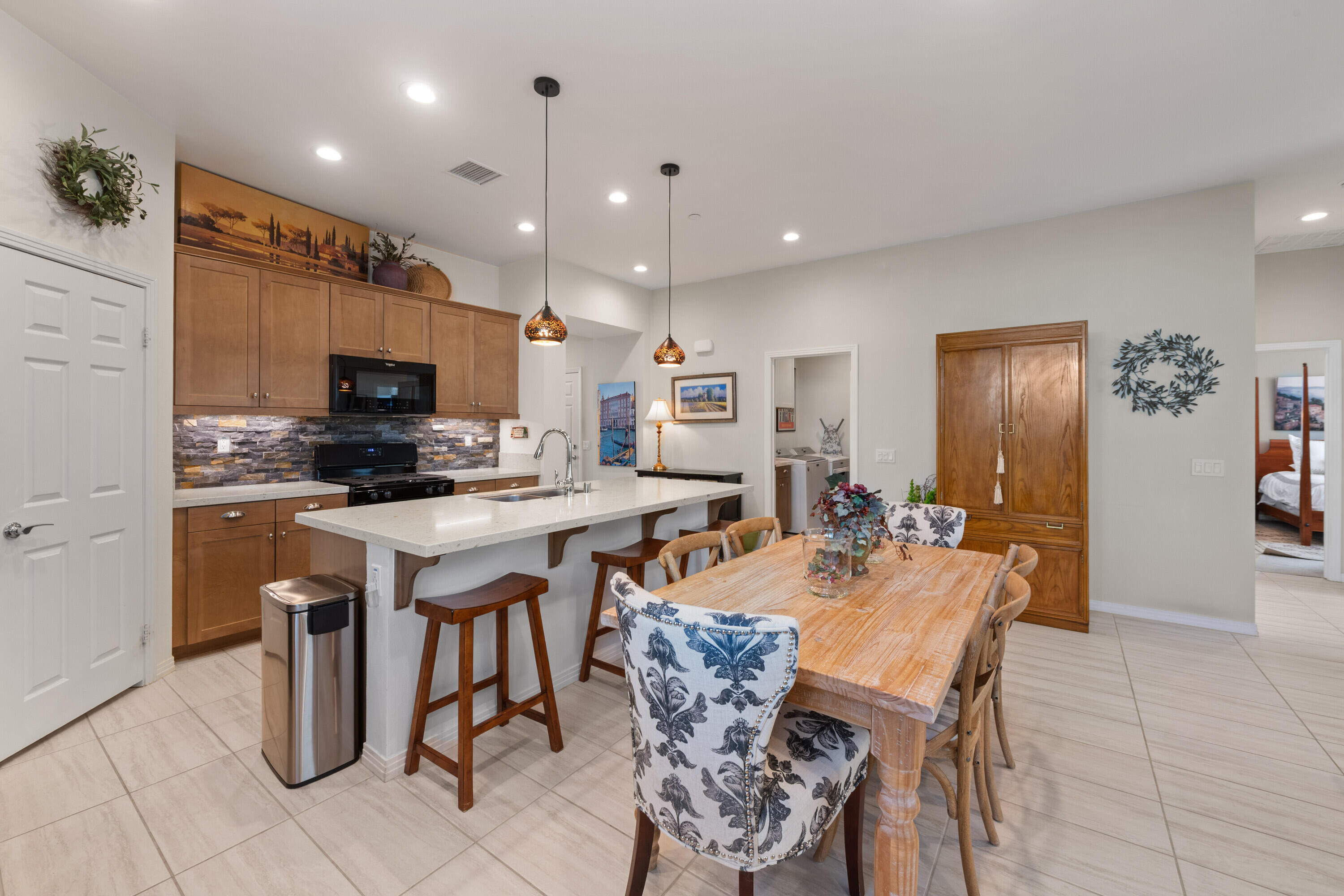 78863 Amare Way Palm Desert, CA 92211 - Photo 21 of 39 a large kitchen with lots of table and chairs