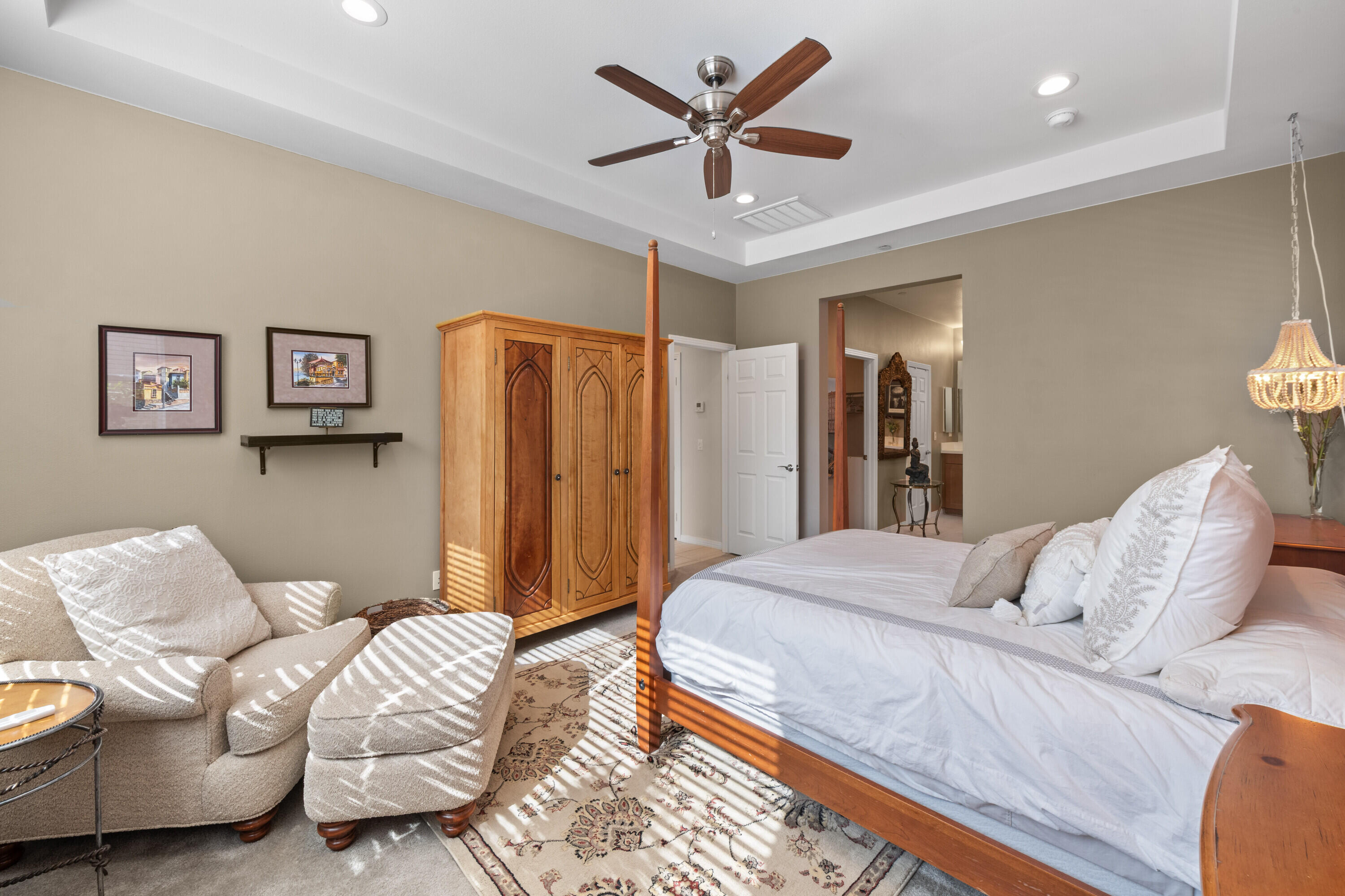 78863 Amare Way Palm Desert, CA 92211 - Photo 26 of 39 a bedroom with a bed and a couch