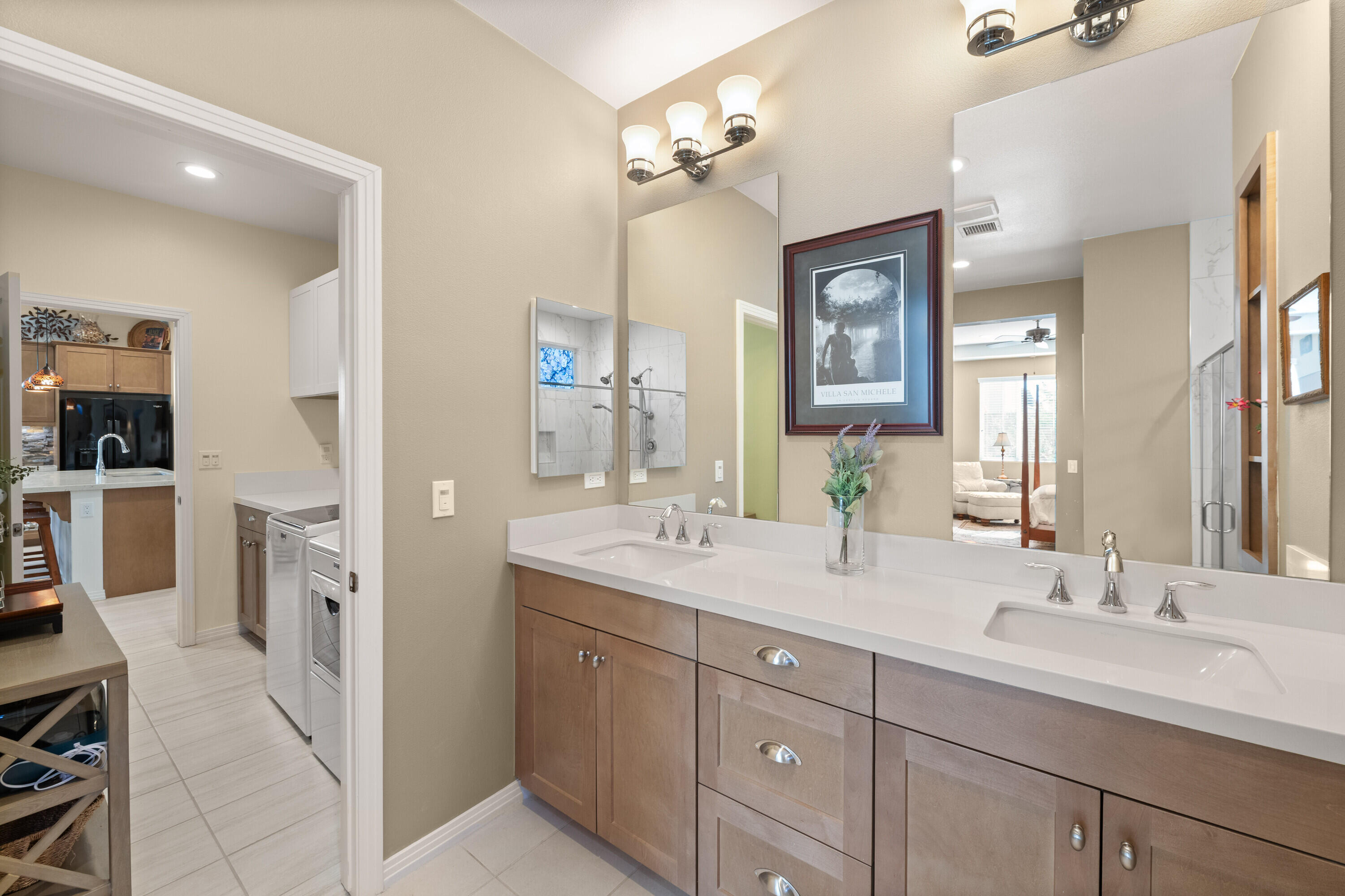 78863 Amare Way Palm Desert, CA 92211 - Photo 28 of 39 a spacious bathroom with a double vanity sink double and mirror