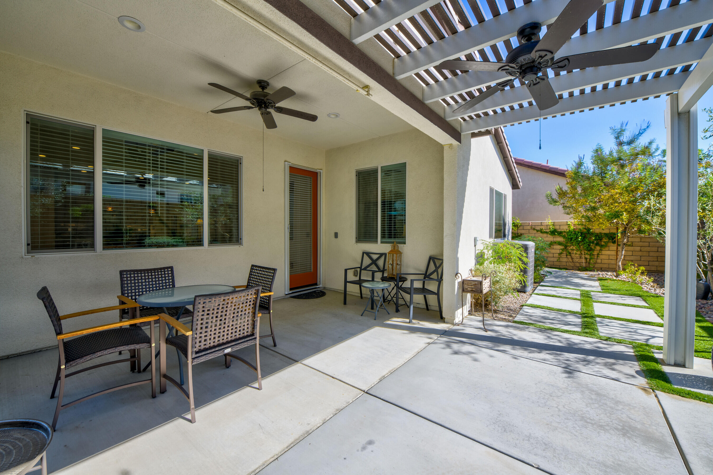 78863 Amare Way Palm Desert, CA 92211 - Photo 34 of 39 a outdoor living space with furniture and a potted plant