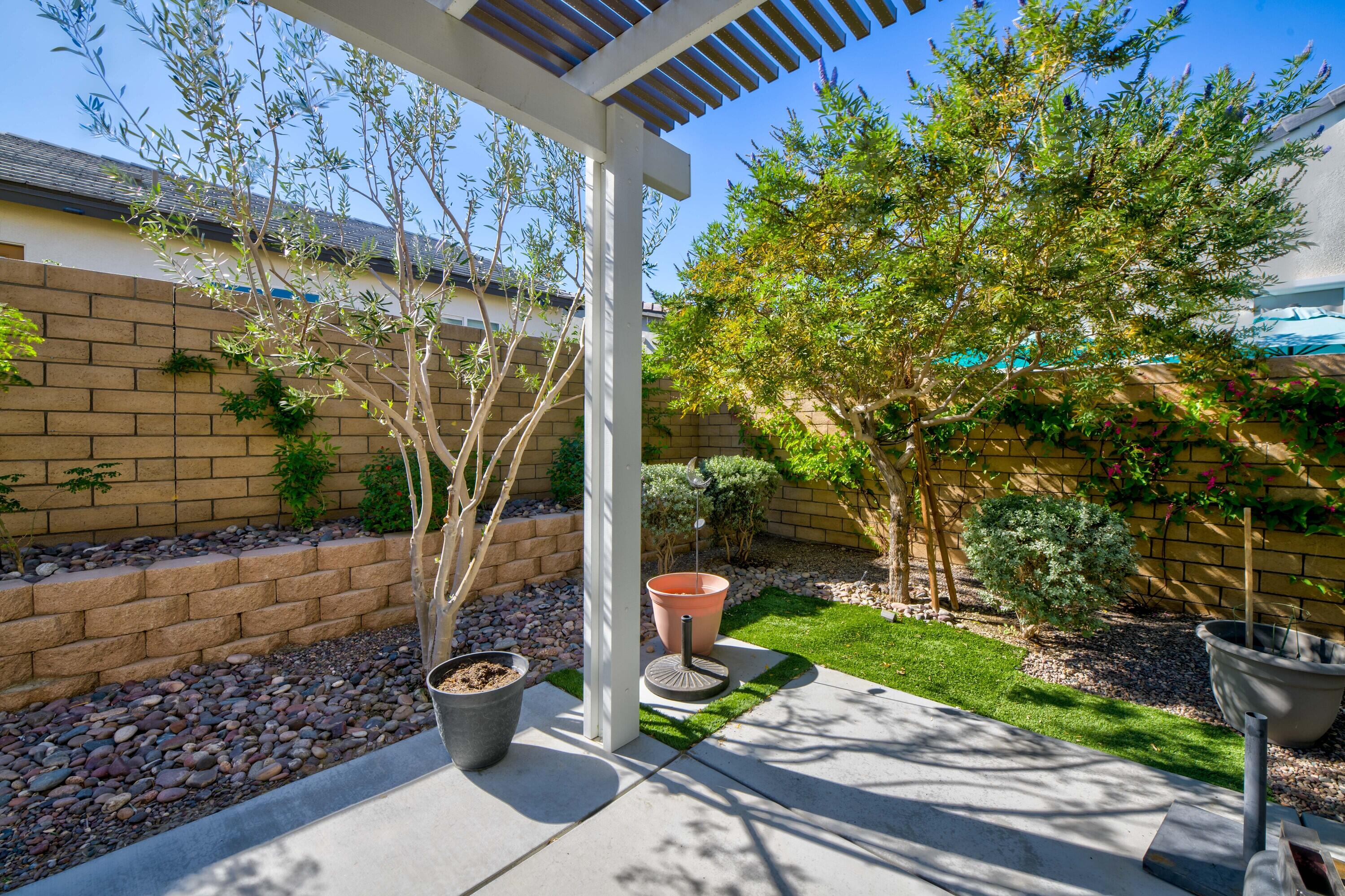 78863 Amare Way Palm Desert, CA 92211 - Photo 36 of 39 a view of a path along with potted plants