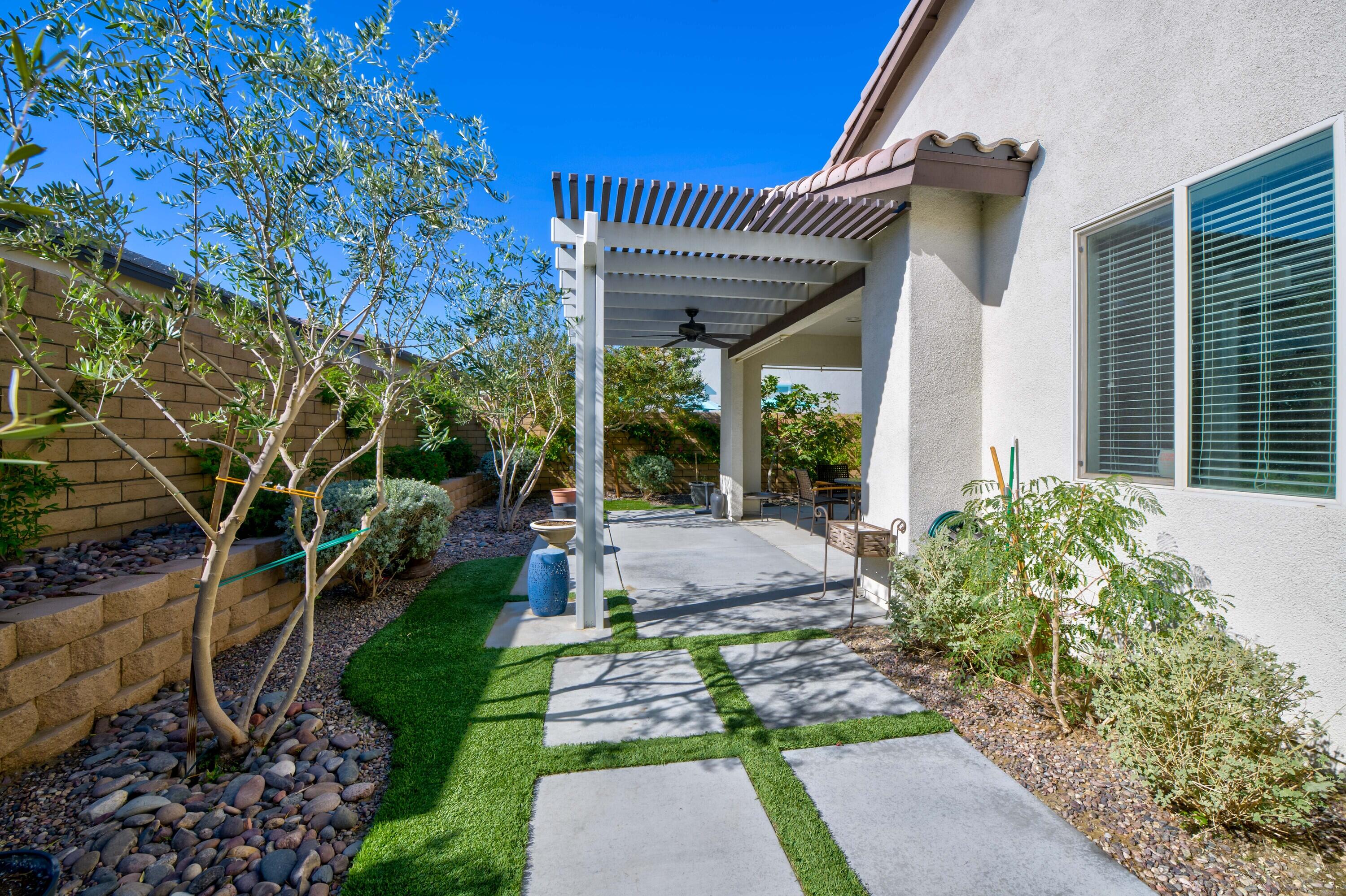 78863 Amare Way Palm Desert, CA 92211 - Photo 38 of 39 a view of a house with a patio