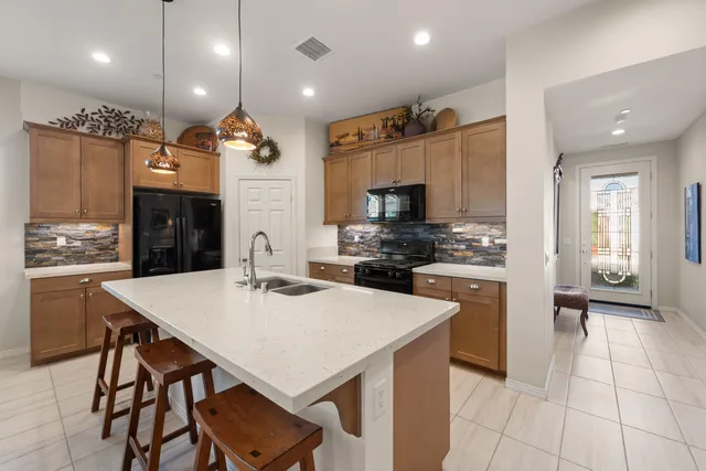 a kitchen with a stove and a microwave