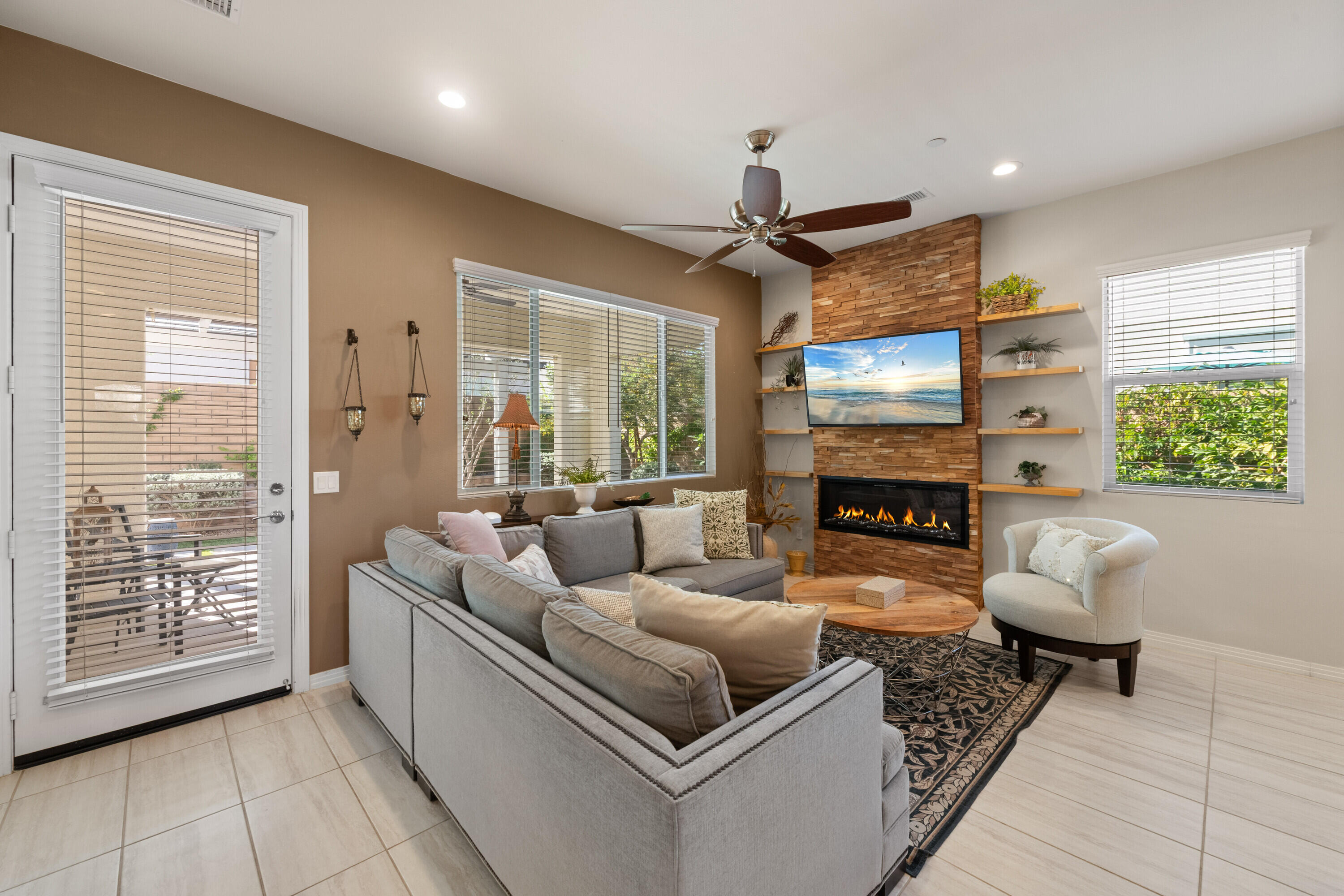 78863 Amare Way Palm Desert, CA 92211 - Photo 10 of 39 a living room with furniture and a fireplace