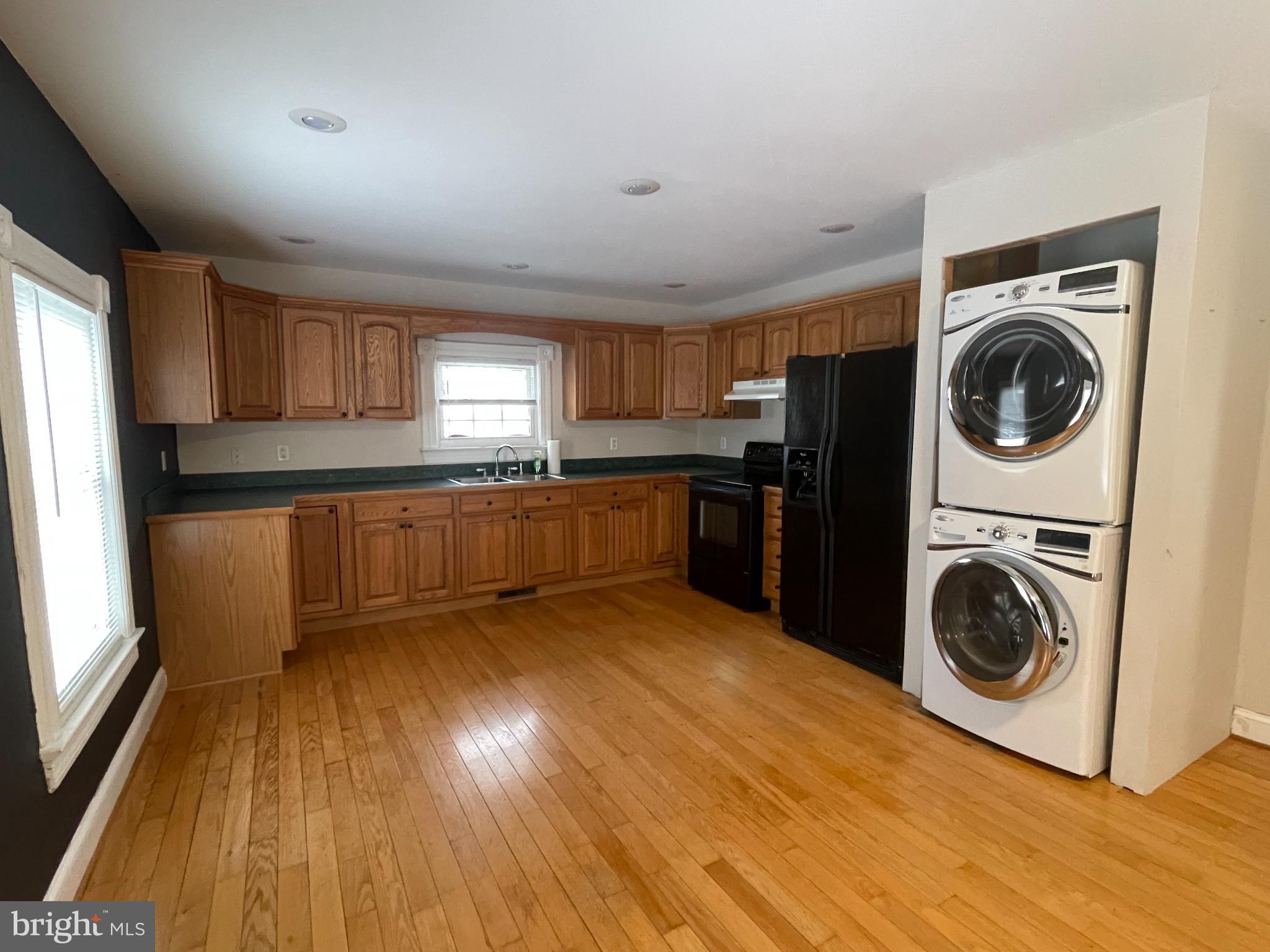 33 Crookhorn Road Montross, VA 22520 - Photo 5 of 18 a kitchen with wooden floors and stainless steel appliances