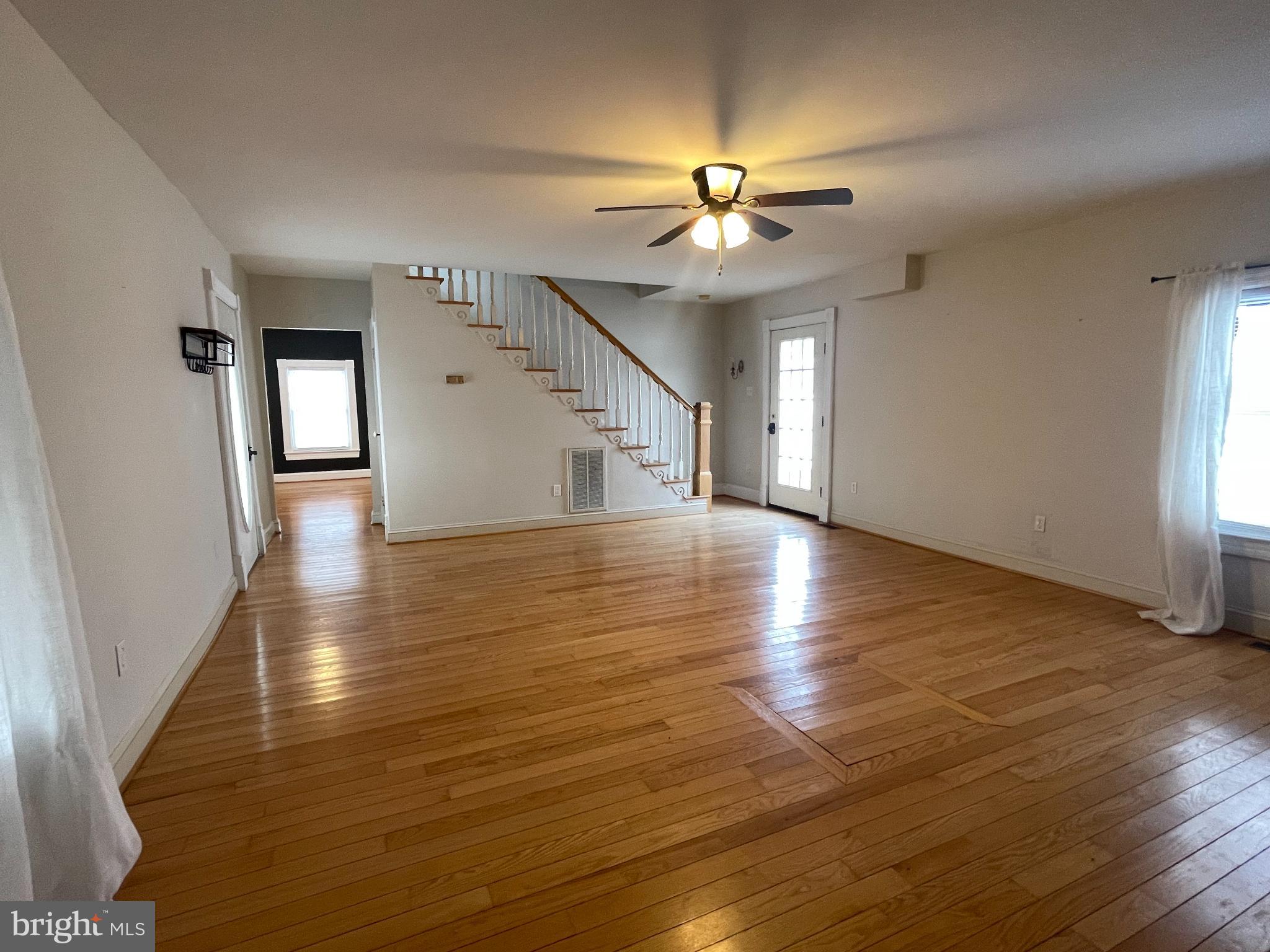 33 Crookhorn Road Montross, VA 22520 - Photo 9 of 18 wooden floor in an empty room with a window