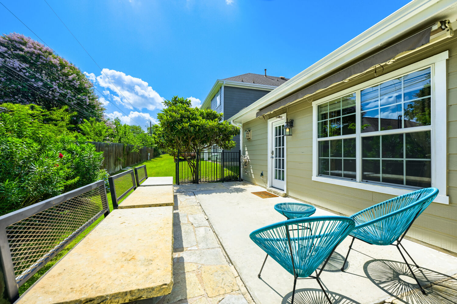 6715 Windrift Way, Unit 28 Austin, TX 78745 - Photo 18 of 19 Built-in seating offers a delightful outdoor retreat.