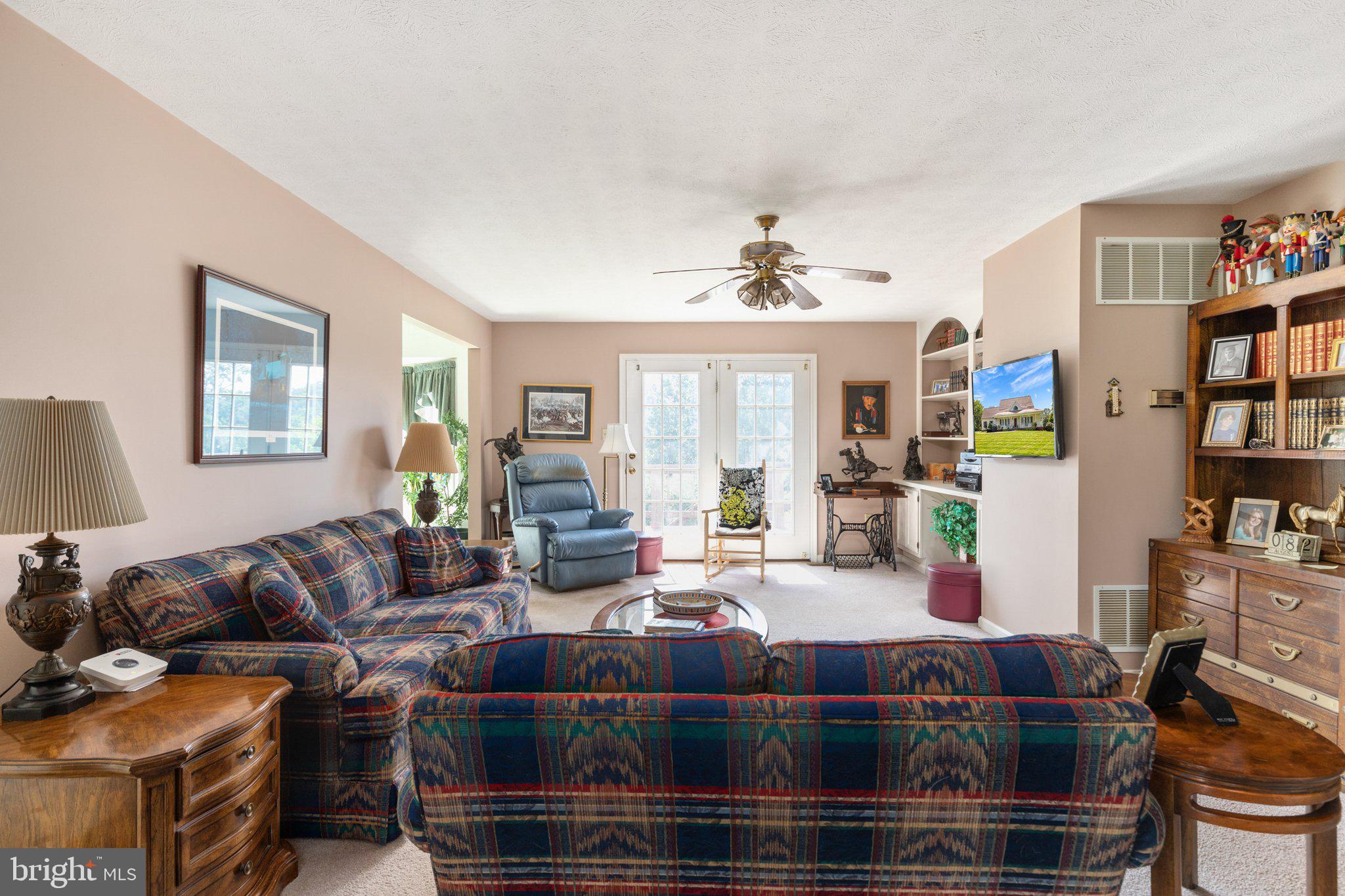 409 Stickley Loop Strasburg, VA 22657 - Photo 9 of 43 Living room with French doors to the rear deck