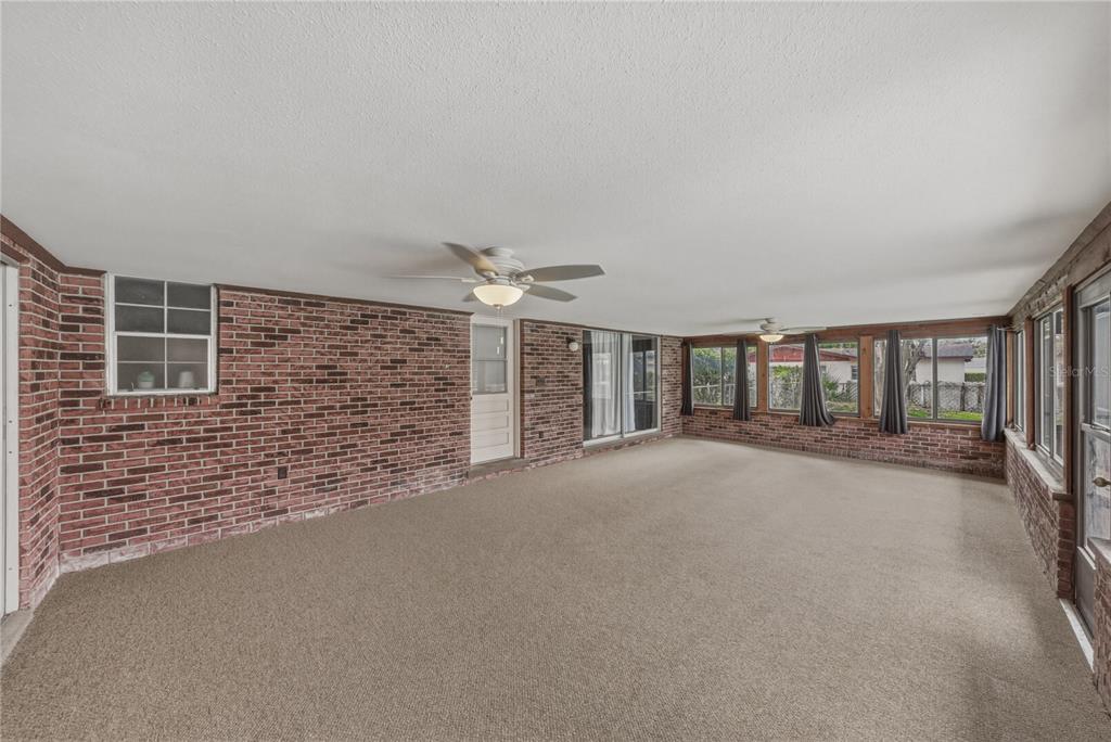 609 West Pipkin Road Lakeland, FL 33813 - Photo 44 of 72 a view of a brick house with a large windows