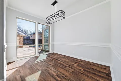 an aerial view of a house with outdoor space