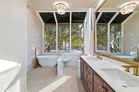 a view of a livingroom with wooden floor and a fireplace