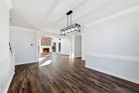 a kitchen with a refrigerator and cabinets